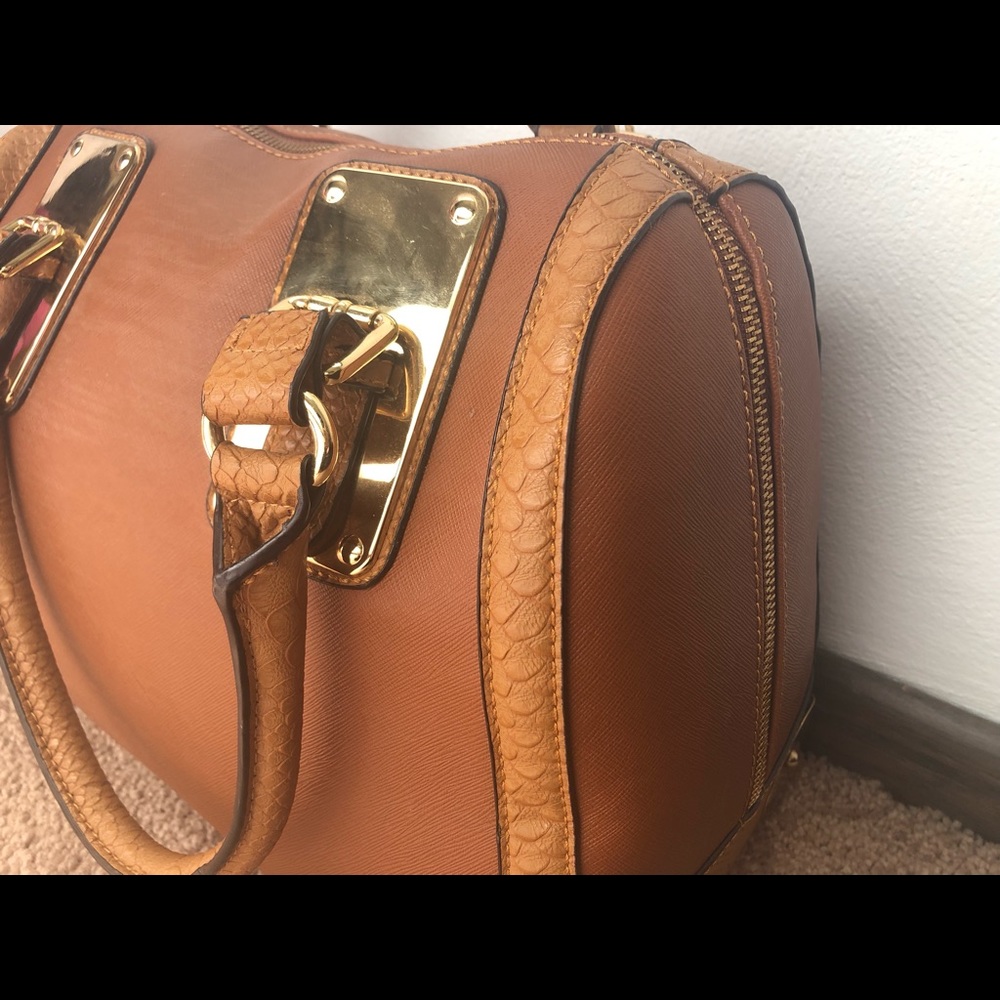 Tan and gold hand bag